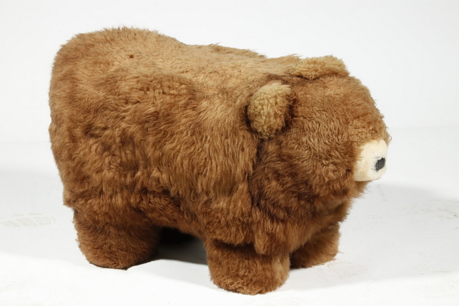 Appraisal: BEAR FORM OTTOMAN Stuffed Bear Form Footstool with wool covered