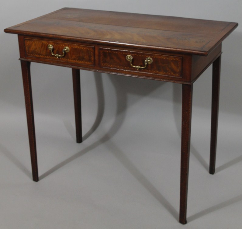 Appraisal: A George III mahogany low boy the overhanging top with