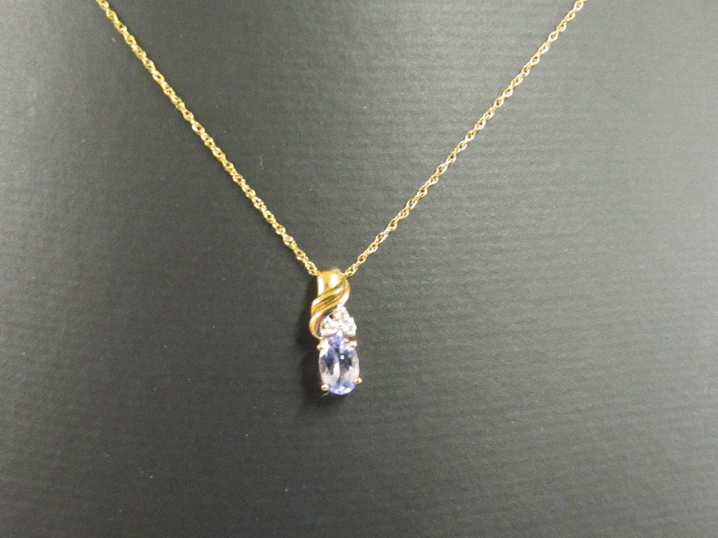 Appraisal: Nine carat gold tanzanite and diamond set pendant on ct