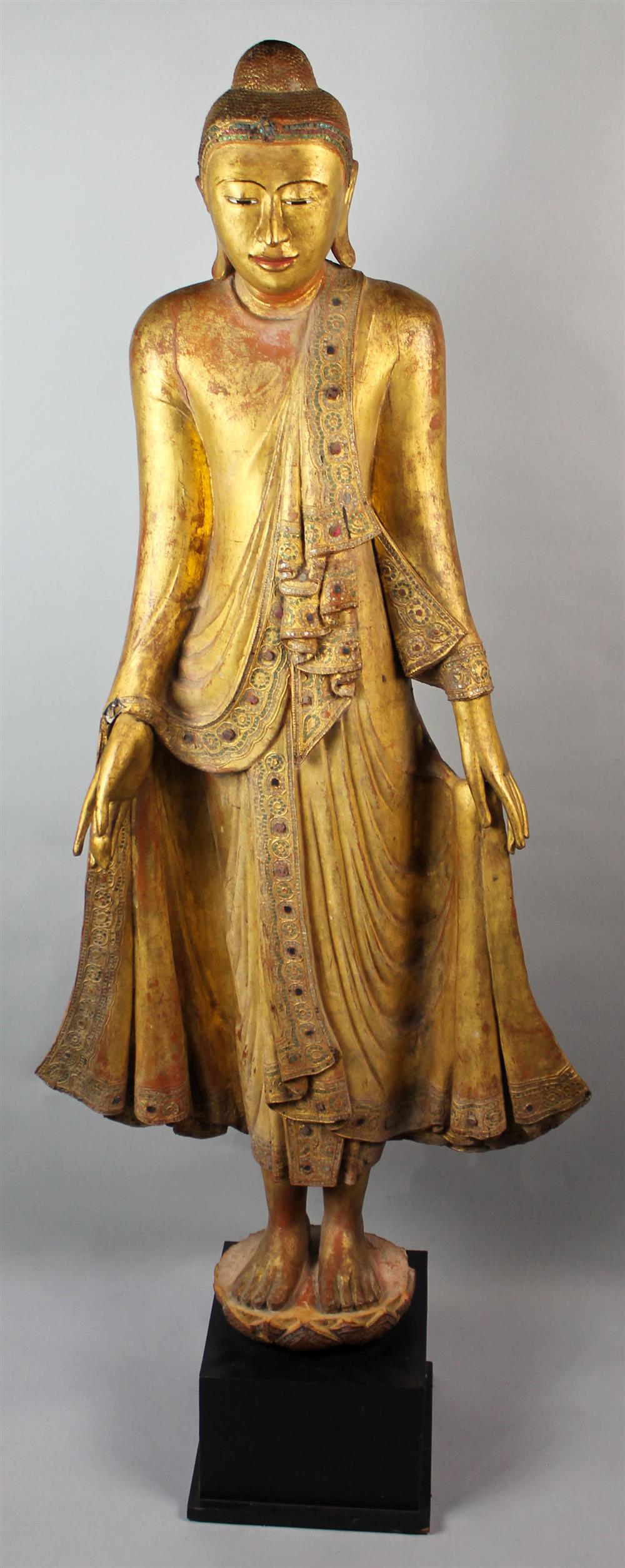 Appraisal: LARGE BURMESE GILT STANDING FIGURE OF THE BUDDHA the standing