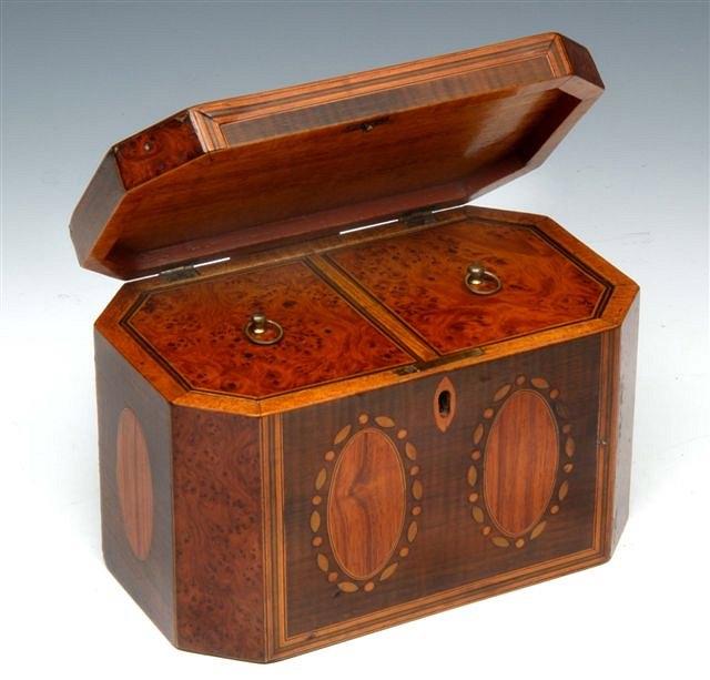 Appraisal: A GEORGE III EIGHT SIDED TEA CADDY the interior fitted