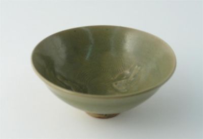 Appraisal: A Chinese celadon small flared bowl the interior carved with