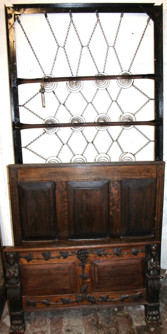 Appraisal: An unusual oak Camel single bed with panelled headboard and