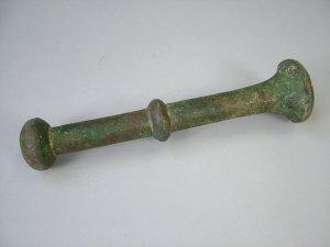 Appraisal: An antique bronze pestle length cm together with a variegated