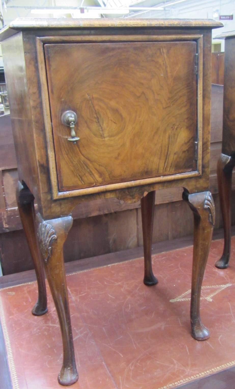 Appraisal: A pair of early th century figured walnut bedside tables