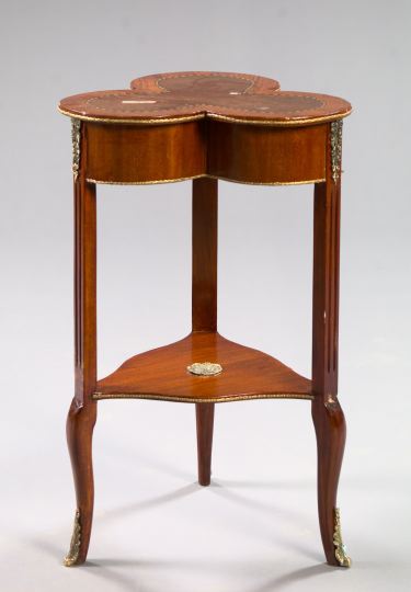 Appraisal: Unusual Ormolu-Mounted Mahogany Occasional Table the banded trefoil-form top joined