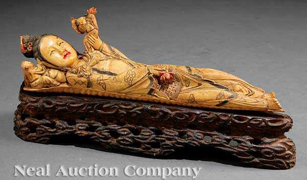 Appraisal: A Japanese Polychrome Decorated Bone Okimono of a Reclining Beauty