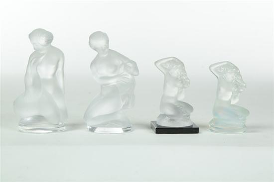 Appraisal: FOUR LALIQUE NUDE FIGURES France th century glass Two kneeling