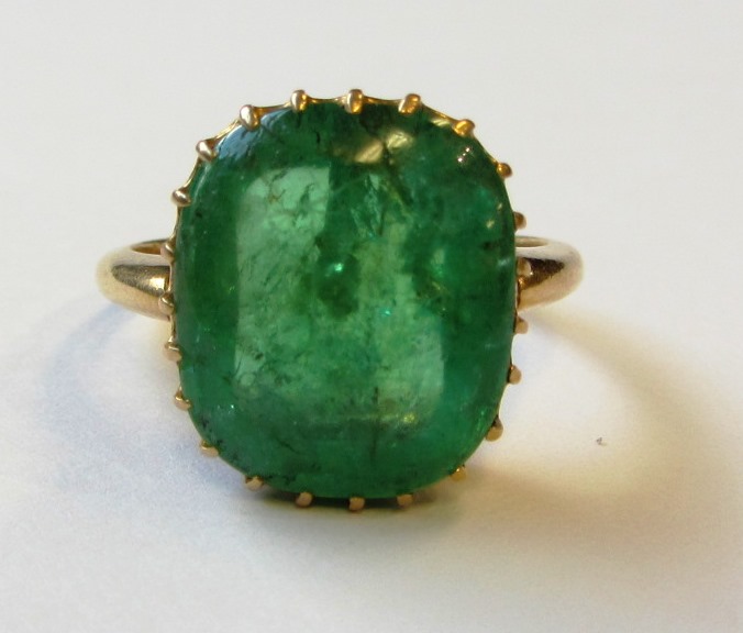 Appraisal: A gold and emerald set single stone ring claw set