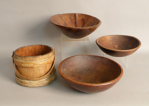 Appraisal: Three turned wood bowls th c largest - dia together