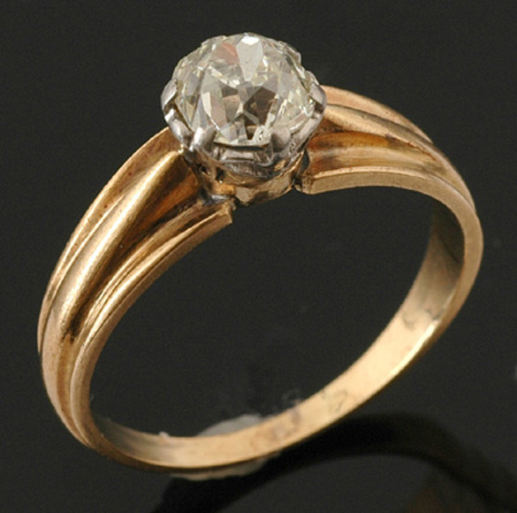 Appraisal: A solitaire diamond ring The old European cut diamond weighing