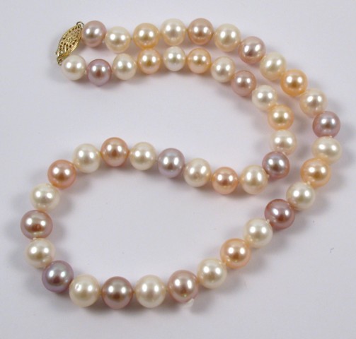 Appraisal: STRAND OF CULTURED PEARLS in varying colors from off white