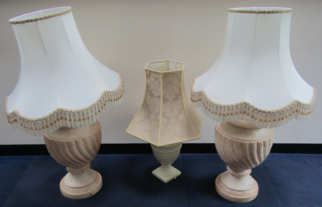 Appraisal: A pair of spiral fluted baluster terracotta table lamps with