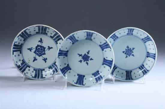 Appraisal: THREE CHINESE BLUE AND WHITE PORCELAIN SAUCERS Kangxi Period Floral