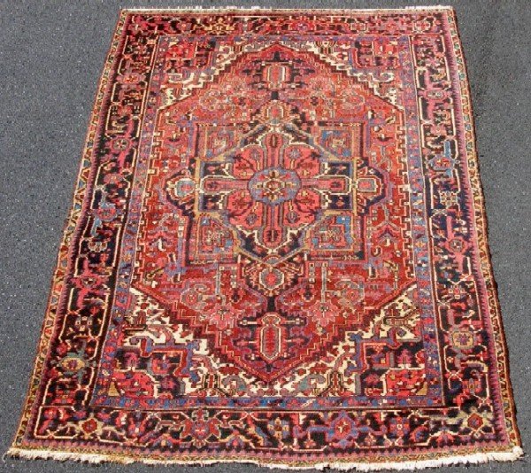 Appraisal: Oriental room size rug th C Handwoven Heriz Dark blue