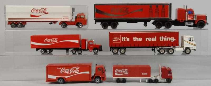 Appraisal: Lot of Coca-Cola Tractor Trailer Truck Toys Description s to