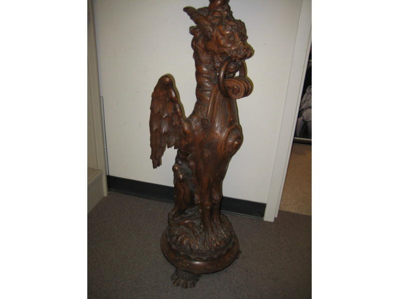 Appraisal: CONTINENTAL CARVED WALNUT PEDESTAL The tall pedestal elaborately carved in