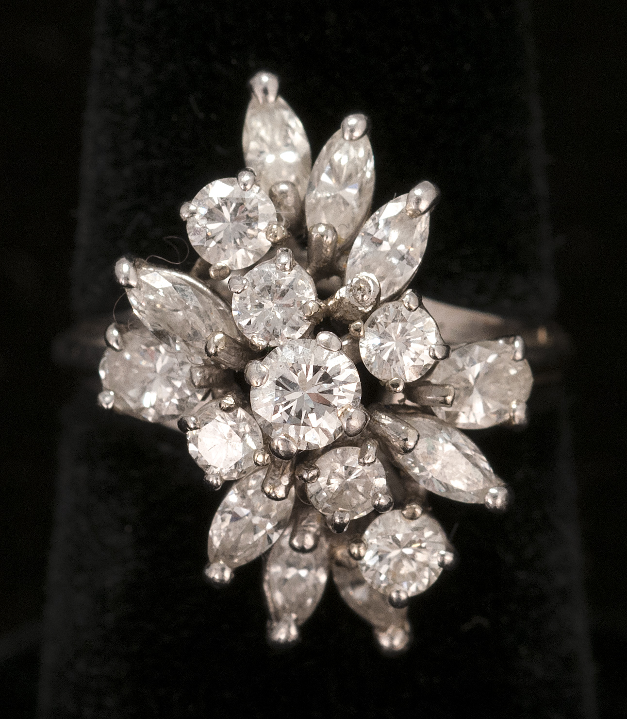 Appraisal: WHITE GOLD AND DIAMOND COCKTAIL RING Mounted with seventeen marquise