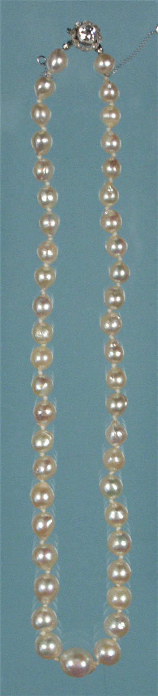 Appraisal: SINGLE STRAND OF GRADUATED BAROQUE PEARL NECKLACE with a round