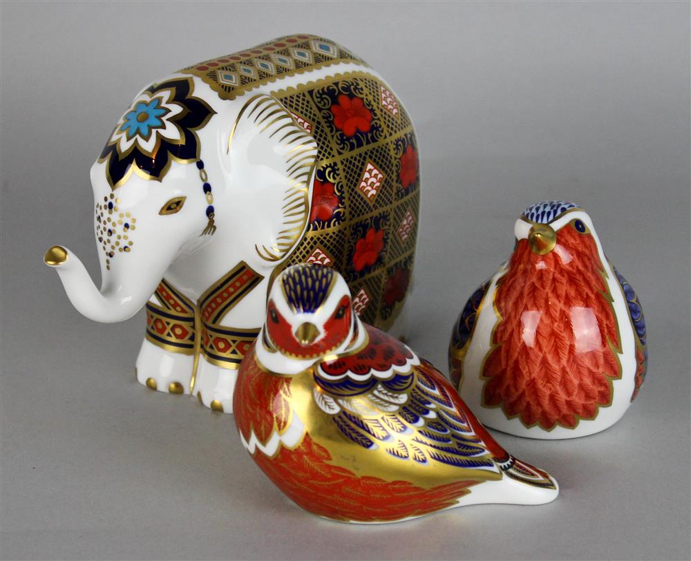 Appraisal: THREE ROYAL CROWN DERBY PAPERWEIGHTS to include an elephant robin