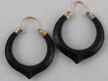 Appraisal: A pair of faceted onyx earrings with yellow metal tests