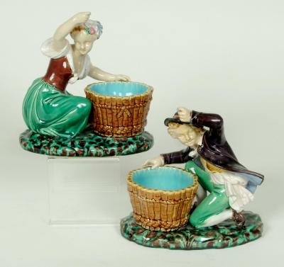 Appraisal: A PAIR OF MINTON MAJOLICA FIGURAL BOWLS comprising boy and