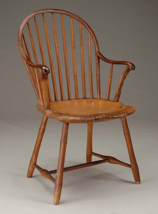 Appraisal: BOW-BACK WINDSOR ARMCHAIR Bamboo turnings with carved scrolled arms having