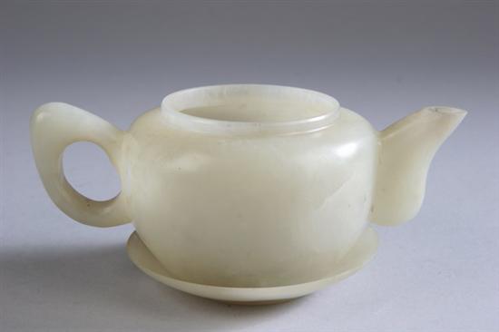 Appraisal: CHINESE CELADON JADE PORCELAIN TEAPOT AND SAUCER Republic period -