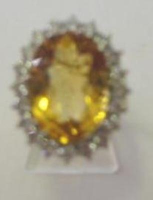 Appraisal: A CITRINE AND DIAMOND DRESS RING the large oval cut