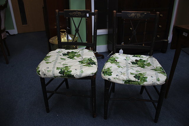 Appraisal: A PAIR OF TH CENTURY EBONISED AND PAINTED BEDROOM CHAIRS