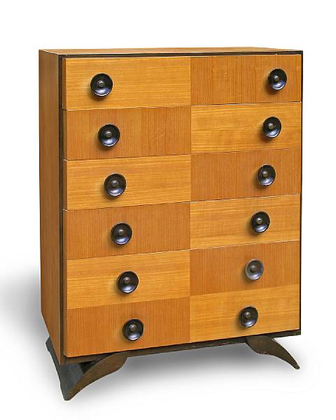 Appraisal: A Gilbert Rohde walnut and American ash chest of drawers