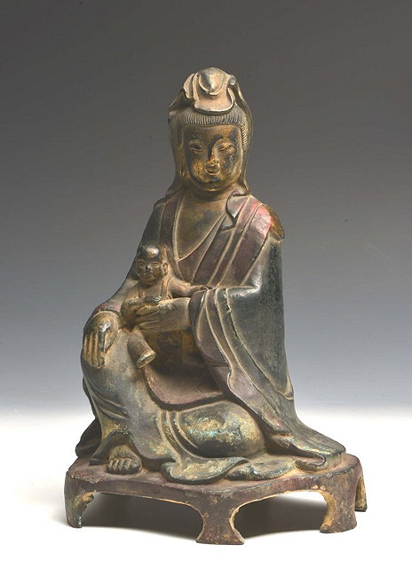 Appraisal: A CHINESE BRONZE FIGURE OF GUANYIN seated on a six