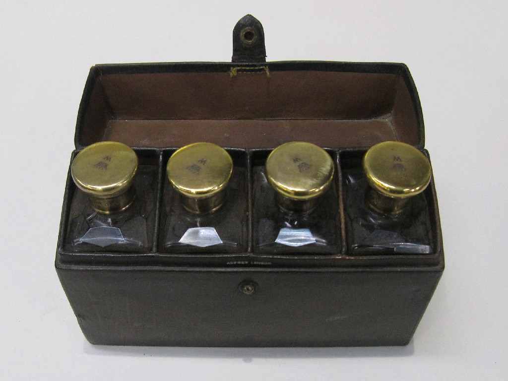 Appraisal: Set of four silver gilt topped flasks in leather case