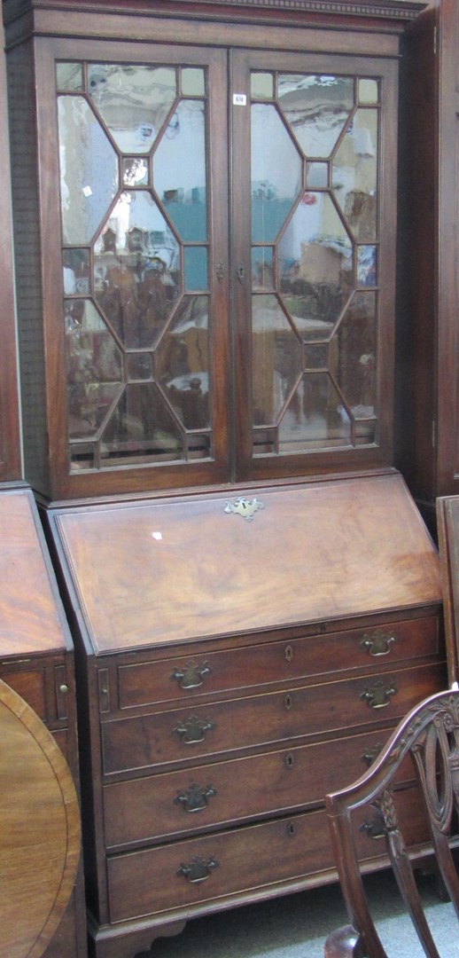 Appraisal: A George III and later mahogany bureau bookcase the pair