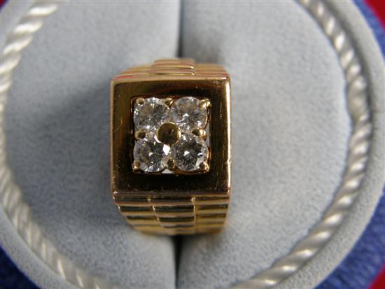 Appraisal: A fancy yellow metal ring of square design set with