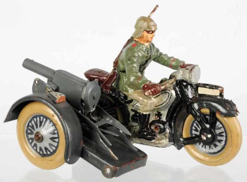 Appraisal: Lineol Motorcycle with Sidecar Machine Gun Sidecar attaching pin needs