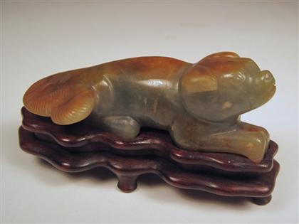 Appraisal: Song-style jade carving of a recumbent houndThe crouching figure of