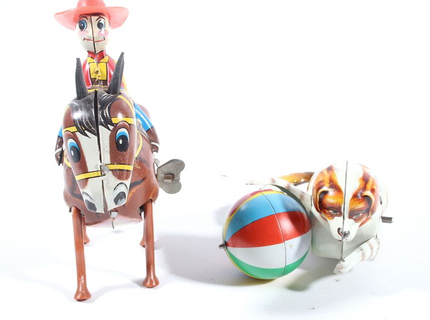 Appraisal: Tin Windup Kohler Dog and Windup Donkey with Rider This