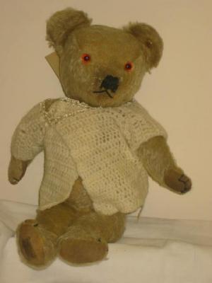 Appraisal: A pre-war Merrythought teddy bear flock filled covered in gold