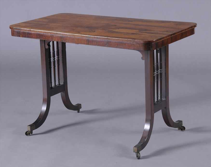 Appraisal: REGENCY STYLE ROSEWOOD CENTER TABLE The top with round corners