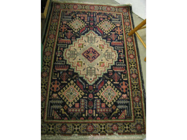 Appraisal: Tabriz Persian Handmade Rug geometrics central medallion deep blue fields