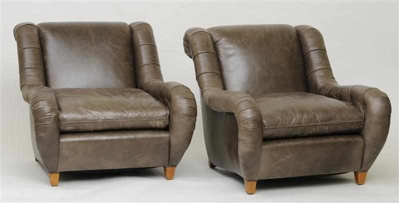 Appraisal: PAIR OF LEATHER UPHOLSTERED ARMCHAIRS ATTRIBUTED TO JAMES MONT With