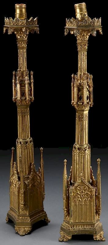 Appraisal: A PAIR OF GILT BRONZE GOTHIC STYLE CANDLE STANDS A