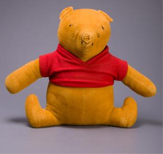 Appraisal: Well-loved hand stitched Winnie-the-Pooh with red shirt having a worn