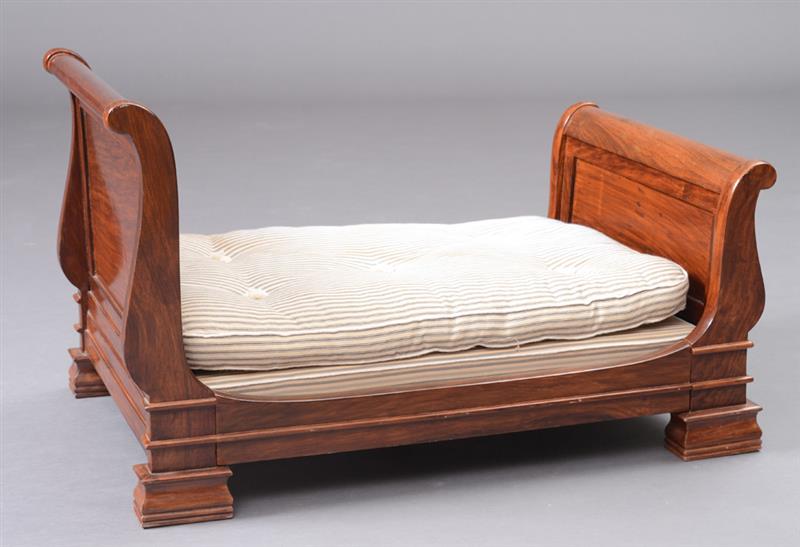 Appraisal: MINIATURE EMPIRE STYLE MAHOGANY SLEIGH BED With outscrolled head and