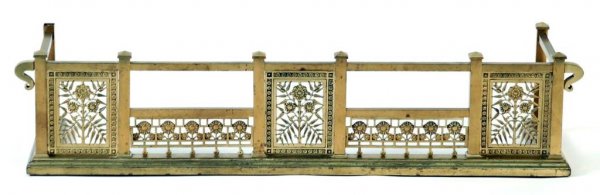 Appraisal: A brass floral fireplace fender in the Aesthetic Movement taste