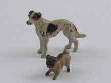 Appraisal: Two cold painted miniature bronze dogs smallest cm long