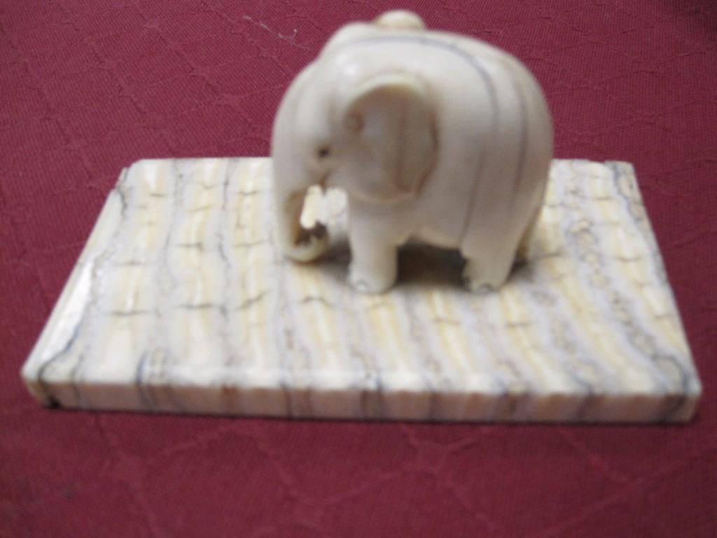 Appraisal: A small carved ivory Figure of an elephant on elephant