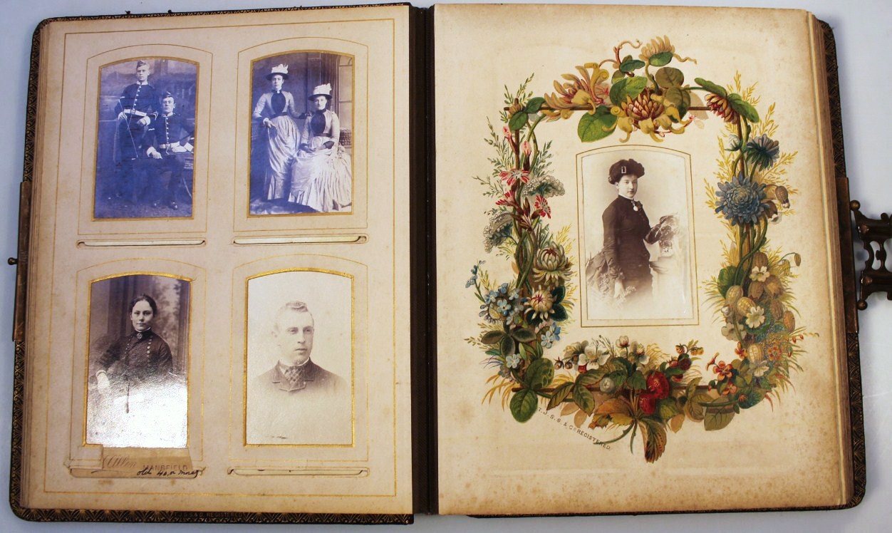 Appraisal: A Victorian photo album with pressed leather partially raised boards