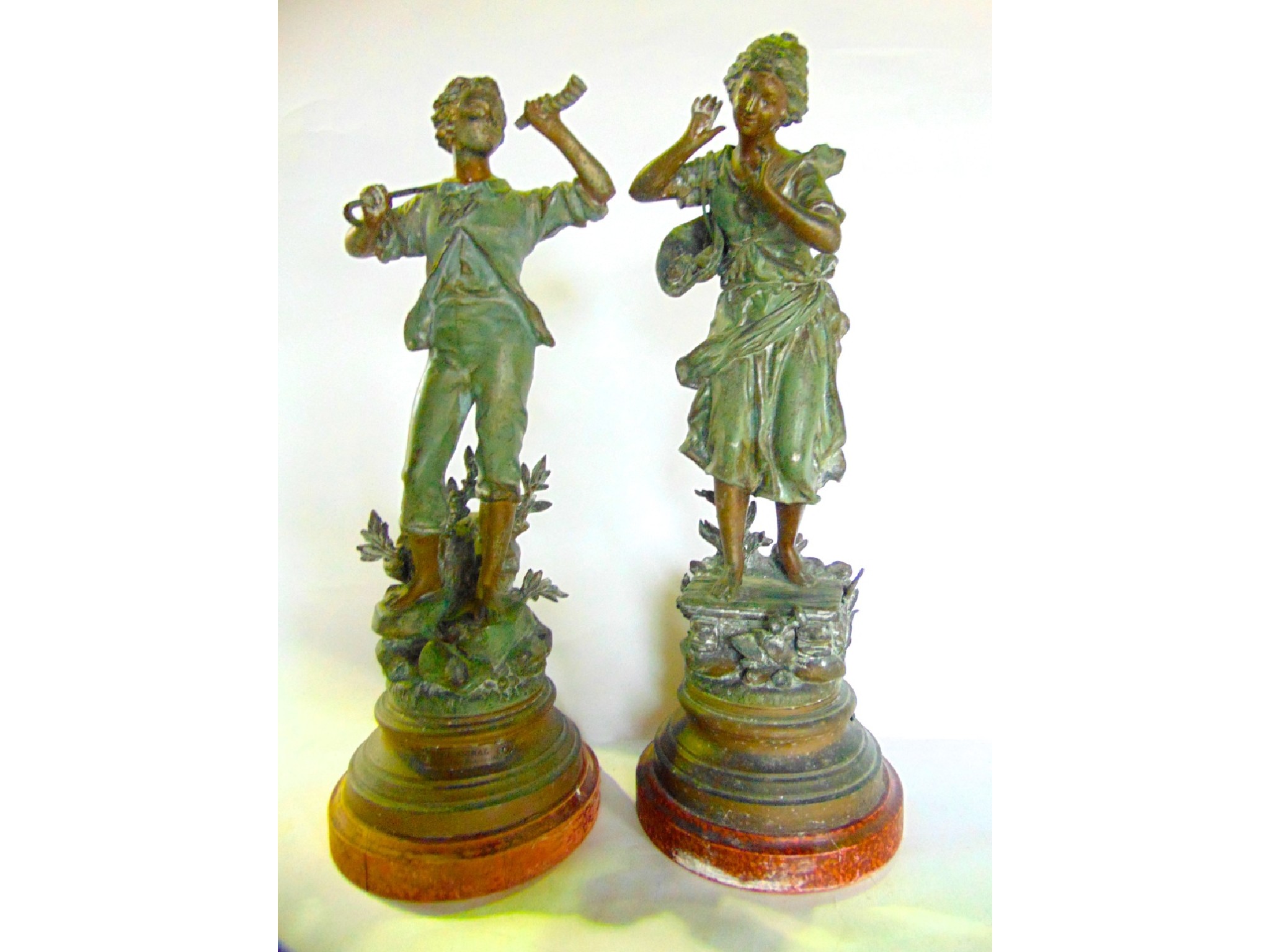 Appraisal: A pair of French painted spelter sculptural figures one depicting